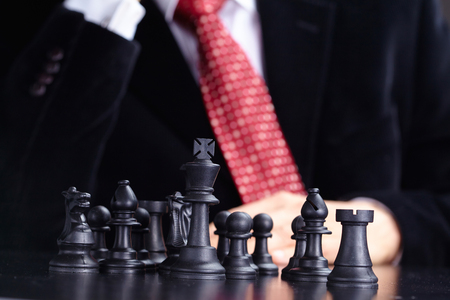 businessman playing chess gameの写真素材