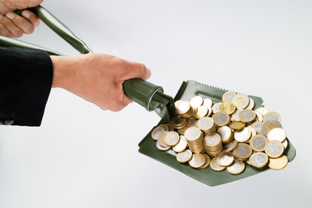 Shovel up moneyの写真素材