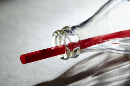 Empty soda bottle and strawの写真素材