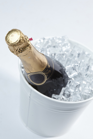 Champagne bottle in a bucketの写真素材