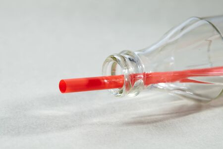 Empty soda bottle and strawの写真素材