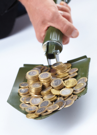 shovel with moneyの写真素材