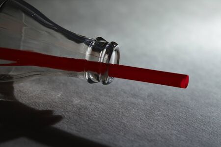 Empty soda bottle and strawの写真素材