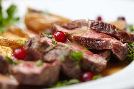 Tasty roasted pork meat with potatoesの写真素材