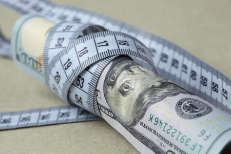 dollars with measuring tapeの写真素材