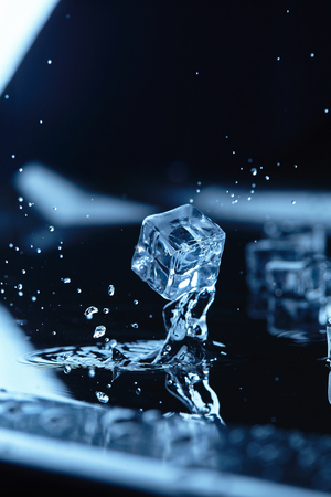 ice cubes with water splashの写真素材