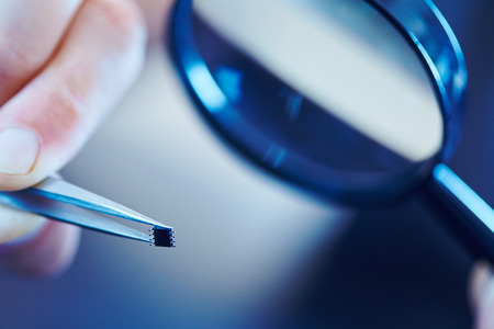 microchip with tweezersの写真素材