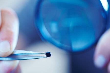 microchip with tweezersの写真素材