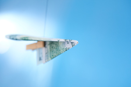 dollar banknote paper airplaneの写真素材