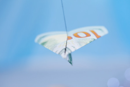 dollar banknote paper airplaneの写真素材