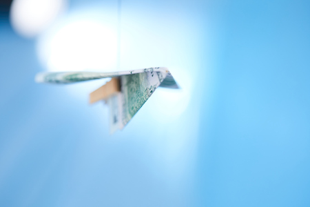 dollar banknote paper airplane