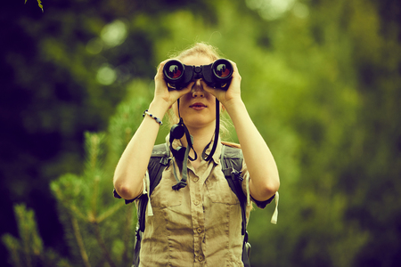 woman with binocularsの写真素材