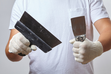 men with putty knifeの写真素材
