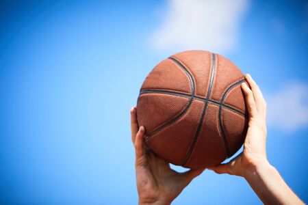 man holding a basketballの写真素材