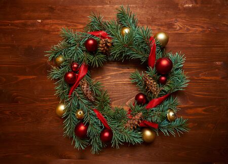 christmas wreath with red and golden ballsの写真素材