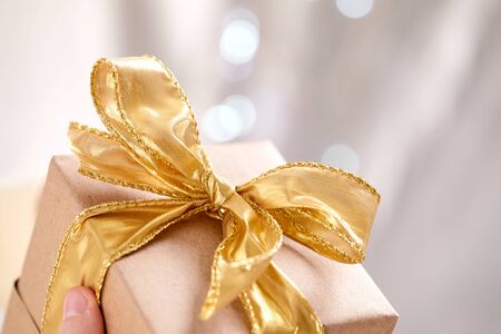 hands holding craft gift boxの写真素材