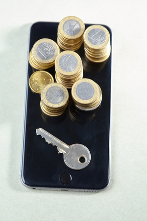 coins on the mobile phoneの写真素材