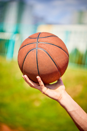 man holding a basketballの写真素材