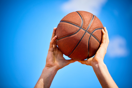 man holding a basketballの写真素材