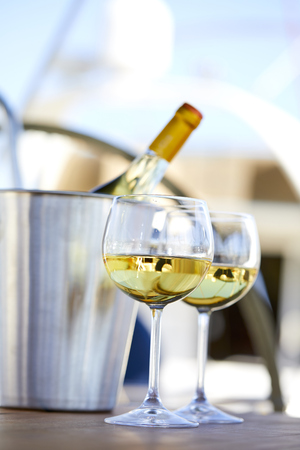 Pair of wineglasses against the yachtの写真素材