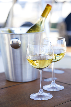 Pair of wineglasses against the yachtの写真素材