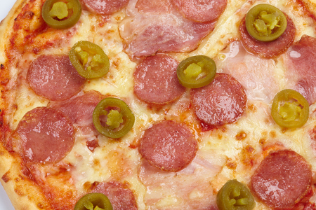 Tasty cooked pizza with toppingの写真素材