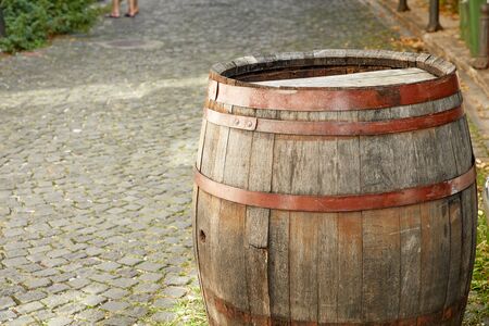Old wine barrel on the paving stones