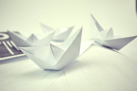 paper boats on the documents