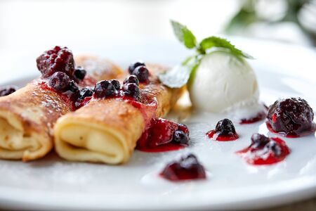 pancakes with berries and ice creamの写真素材