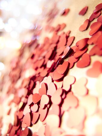 hearts confetti on the golden background