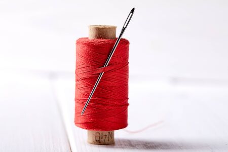 bobbins with thread and needles