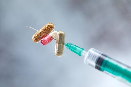 medical syringe with drug and pills
