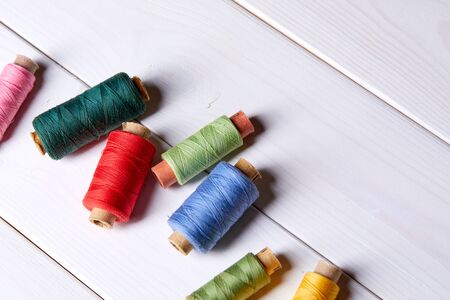 bobbins with thread and needles