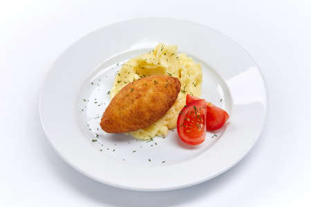 cutlet with mashed potato and tomatoの写真素材