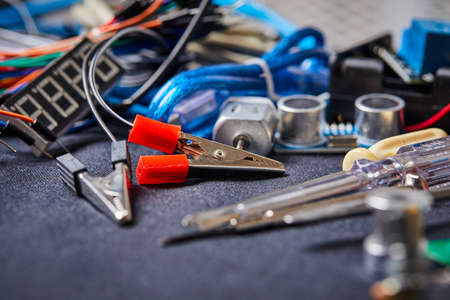 electronic board and tools repairs on black background