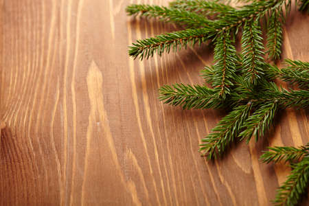 New Year concept, fir branch on the wooden backgroundの写真素材