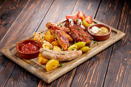 meat appetizer on the wooden backgroundの写真素材