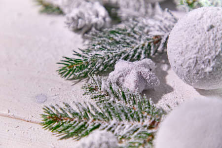 Christmas card - Christmas tree branches on the wooden background