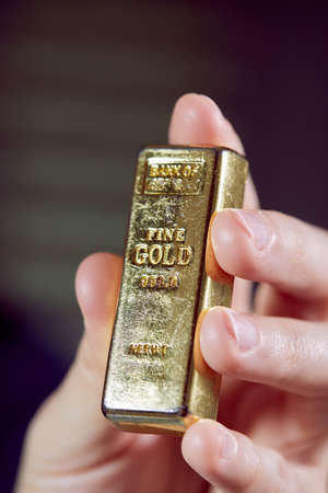 golden bar on the man's handの写真素材