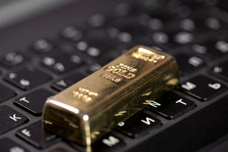 golden bar on the keyboardの写真素材