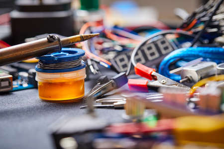electronic board and tools repairs on black background