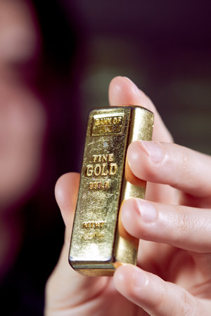 golden bar on the man's handの写真素材