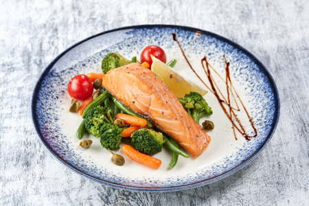 salmon steak with roasted vegetablesの写真素材