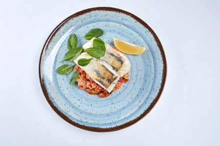 white fish with rice and vegetablesの写真素材