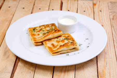 stuffed pancakes with sour creamの写真素材