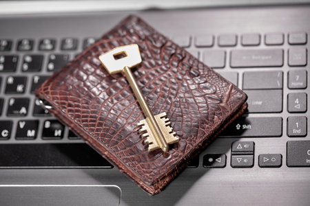 purse and key on the keyboardの写真素材