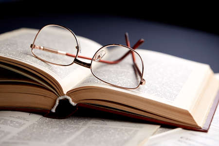 glasses on the book pages