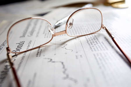 eyeglasses on the newspaper pages