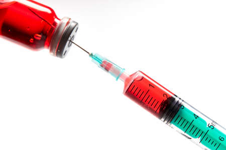 Vaccine in vial with syringeの写真素材