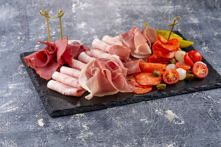meat appetizer on teh stone board
